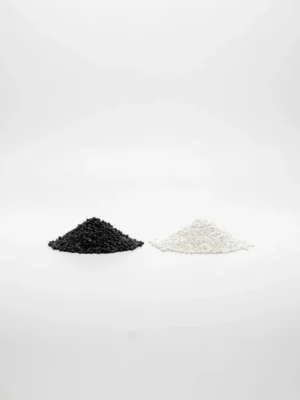 Black and White Masterbatch — Product Photo Small black and white masterbatch pellets side by side on a clean white background